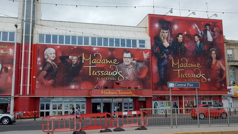 Madame Tussauds Blackpool 1 Exterior of Madame Tussauds Blackpool with large posters of wax figures on the building facade.
