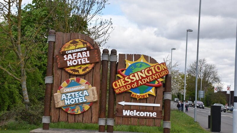 Chessington World of Adventures Resort 1 Welcome sign for Chessington World of Adventures Resort with directions to Chessington Safari Hotel and Chessington Azteca Hotel.