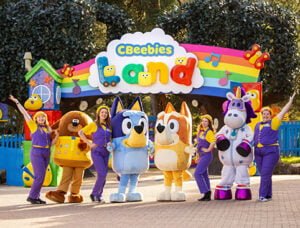 CBeebies Land entrance with people in cartoon character costumes and performers.